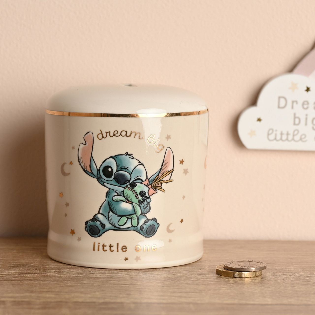 Bring the magic of Disney into your home with our charming Stitch Baby Money Bank, a playful ceramic treasure featuring the lovable character from Lilo & Stitch.