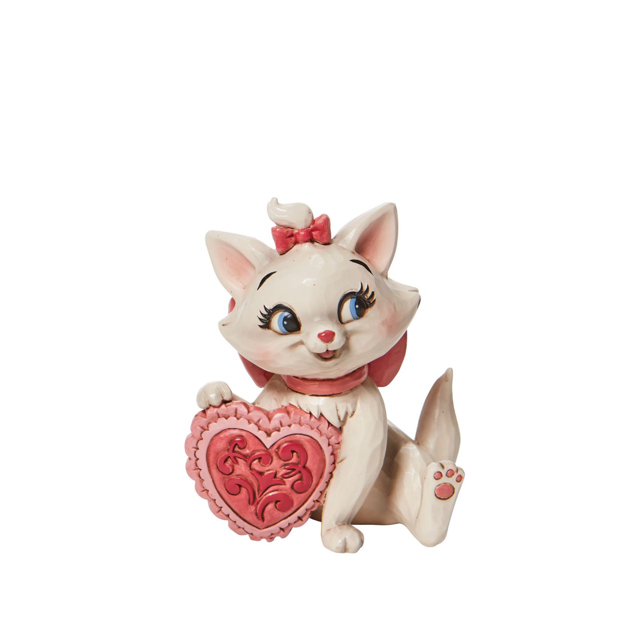 The 1970 Walt Disney classic, The Aristocats, followed three kittens and their mother across the Parisian countryside after being cat-napped from their home. Marie, the only daughter of the bunch, holds a pink heart in this sweet Jim Shore figurine.