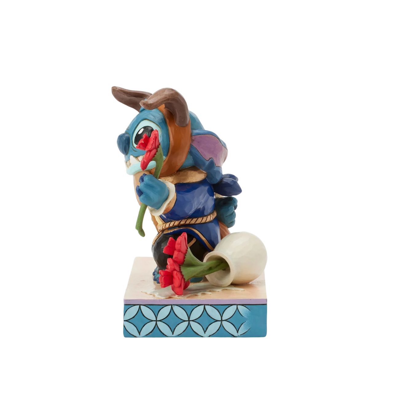 In this charming Jim Shore design, Stitch takes on the role of the Beast from Disney's beloved tale, dressed in the iconic blue suit. With an adorable smile, Stitch presents a flower, to you the collector.