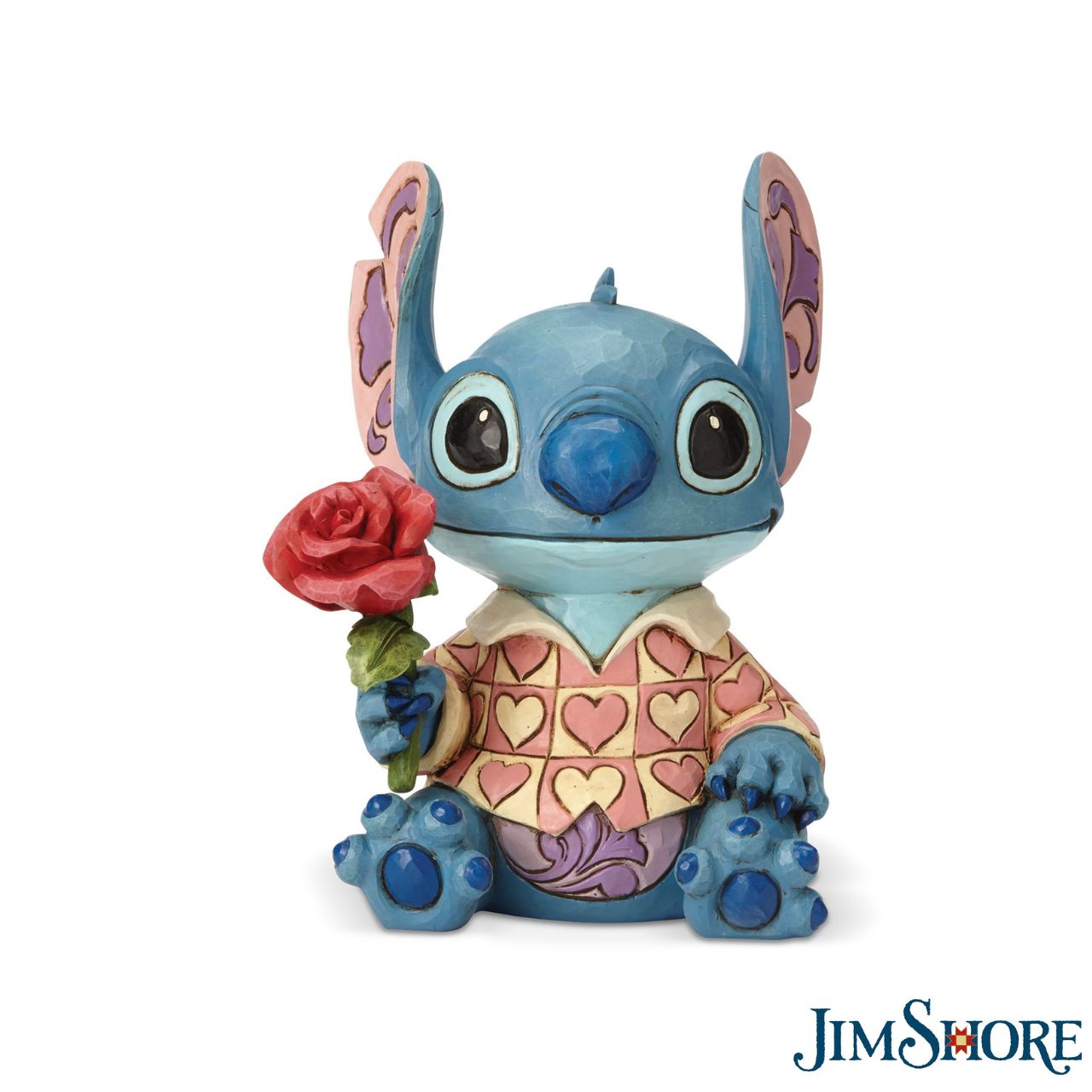 Jim Shore Clueless Casanova Stitch Figurine Stitch has transformed into a model citizen that Lilo would be proud of! Designed by Jim Shore, the adorable alien wears a heart-patterned shirt as he offers a single red rose. Stitch makes a great gift for your Ohana.