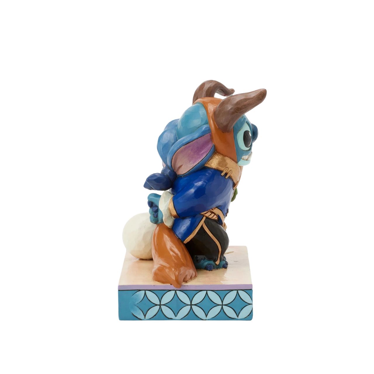 In this charming Jim Shore design, Stitch takes on the role of the Beast from Disney's beloved tale, dressed in the iconic blue suit. With an adorable smile, Stitch presents a flower, to you the collector.