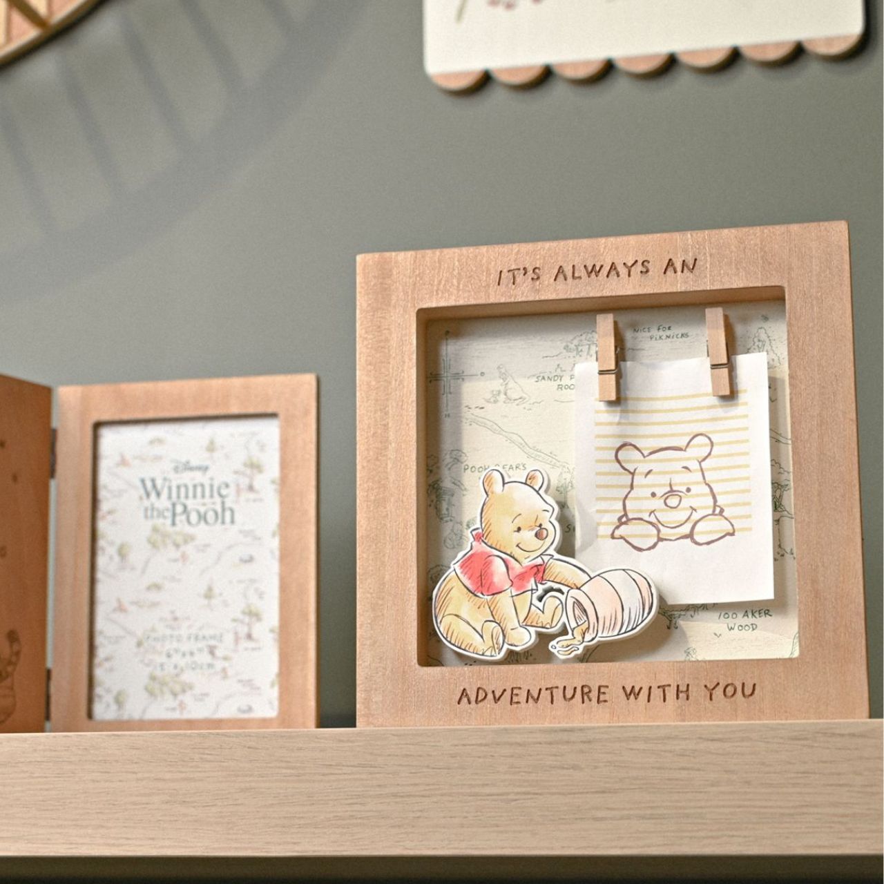 Featuring an enchanting cartoon illustration, a charming map, this frame brings the magic of the Hundred Acre Wood to life.
