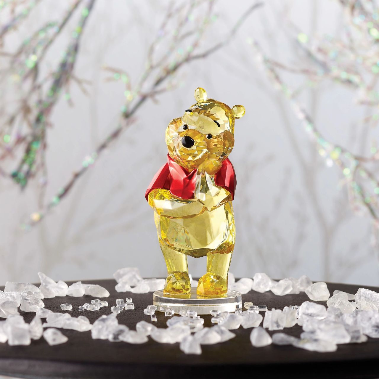 Disney Winnie The Pooh Facets Figurine This "gem cut" acrylic sculpture reflects Winnie the Pooh's honey-sweet charm and whimsical personality. Presented in a branded window gift box. Not a toy or childrens product. Intended for adults only.