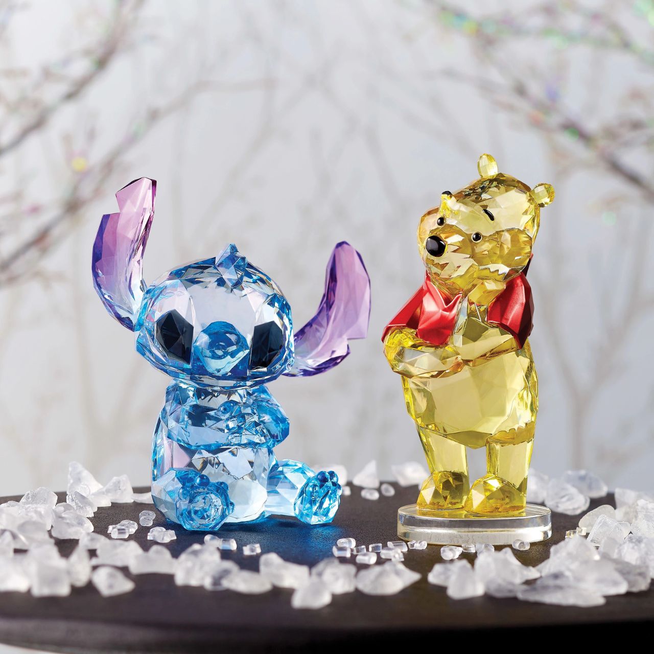 Disney Winnie The Pooh Facets Figurine This "gem cut" acrylic sculpture reflects Winnie the Pooh's honey-sweet charm and whimsical personality. Presented in a branded window gift box. Not a toy or childrens product. Intended for adults only.
