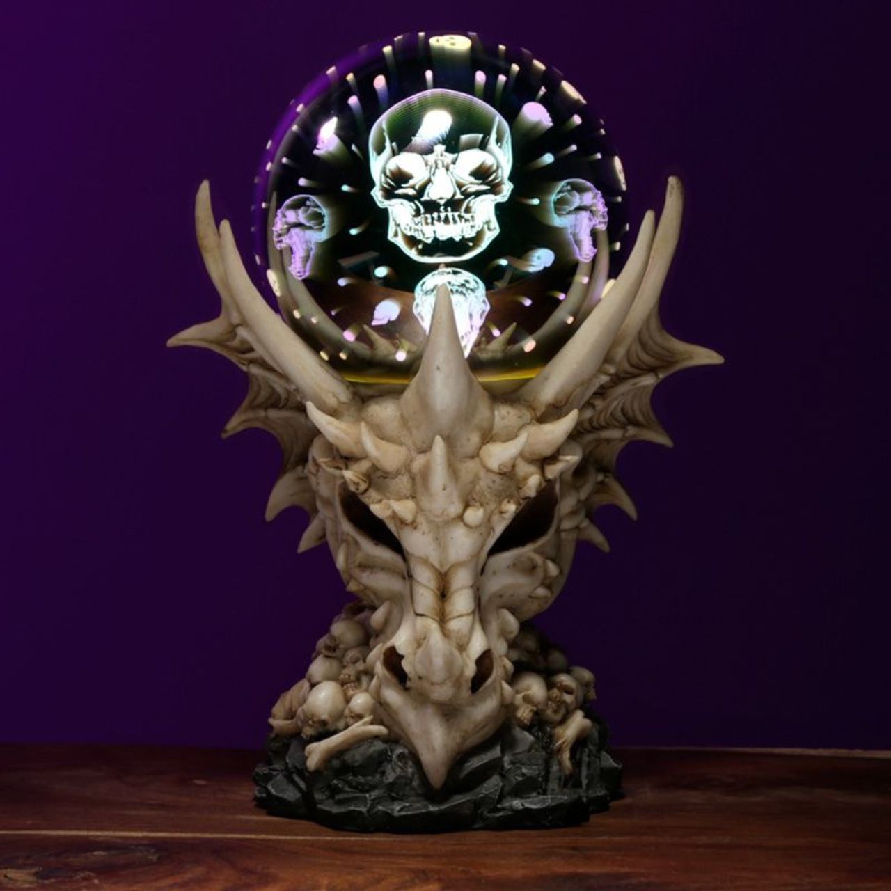 Dragon Skull LED Metallic Orb - Material: Resin and Plastic - Batteries Required: 2 AA - Batteries Included: No - LED: Controlled by an on/off switch on the bottom, the LED rotates between multiple colours.