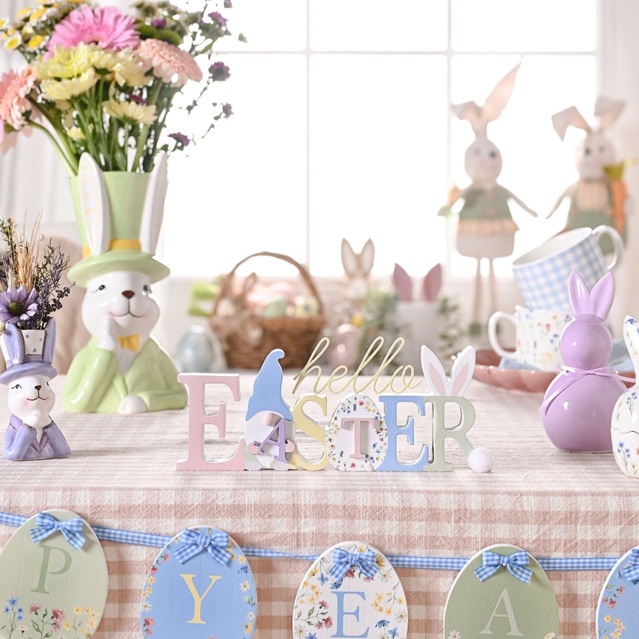 Bring a playful touch to your product line with the Eggs-traordinary Gifting Company's set of three Bunny in Top Hat Planter's Featuring adorable bunnies in three pastel colours, pink, purple and green. This charming set of planters adds a whimsical flair on their own and even more vibrancy when paired with plants or flowers.