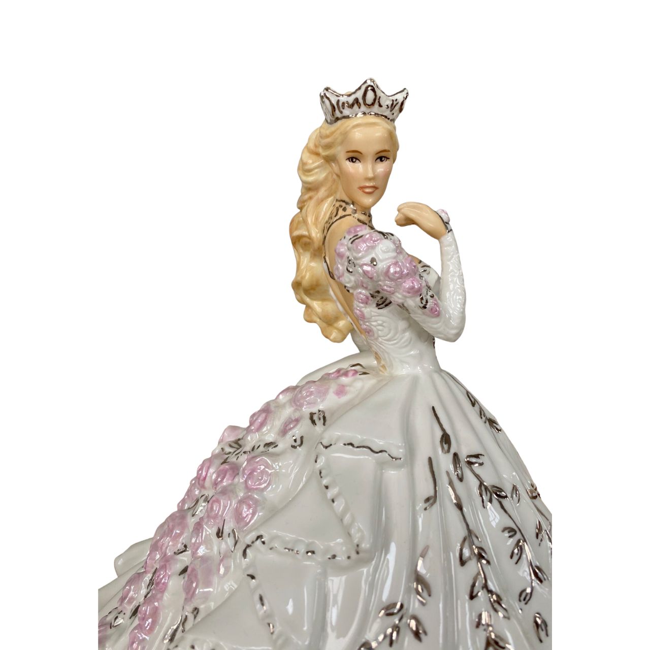 Gypsy Rose Blonde by English Ladies Company Thelma Madine’s stunning gown is recreated in this elegant bone china figurine. Floral details spill down the back of the dress and across the shoulders; with real platinum highlights adding the finishing touches.