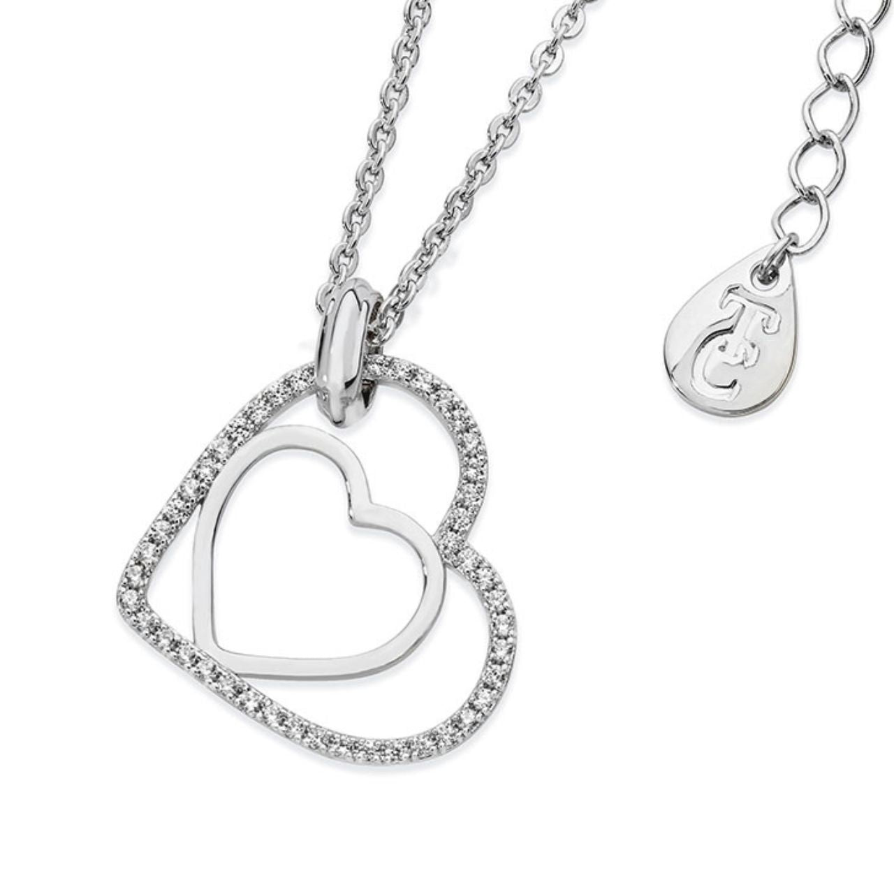 Floating Heart Pendant Silver by Tipperary Crystal Especially for the one you love this meaningful design is styled in sleek silver. It features two open hearts - one smaller polished silver heart set inside the larger outline heart with a glittering border of clear crystal accents. This captivating pendant is finished with a brightly polished bale and suspends freely at a tilt along a cable chain which secures with a lobster claw clasp with 2” extension and a TC branded fob.