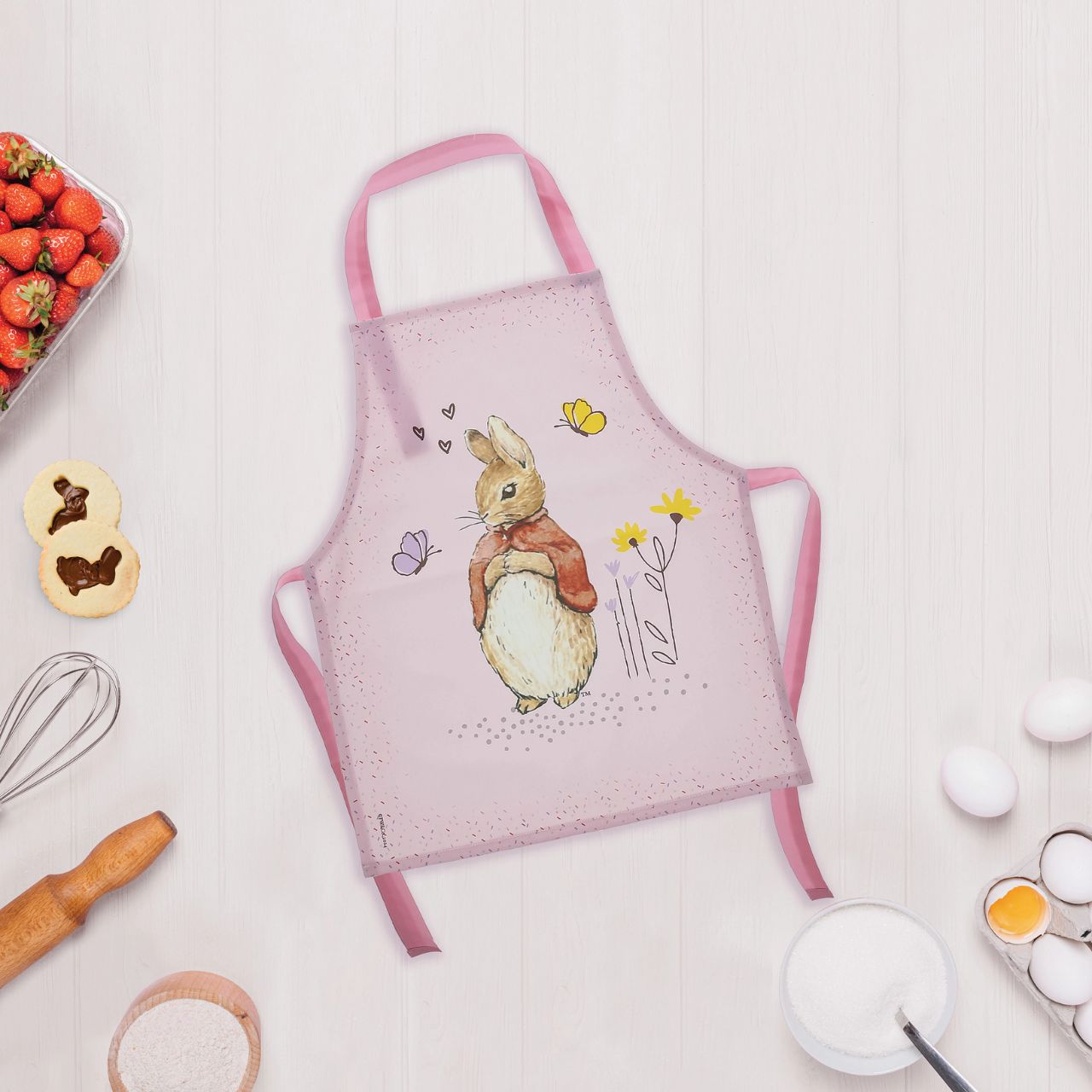 Introducing the delightful Flopsy Bunny apron, designed to make every cooking or crafting adventure a memorable one. Crafted with a super soft, wipeable fabric, it ensures easy clean-up, while the hook & loop tape fastening on the neck tie offers extra safety and comfort for your little one.
