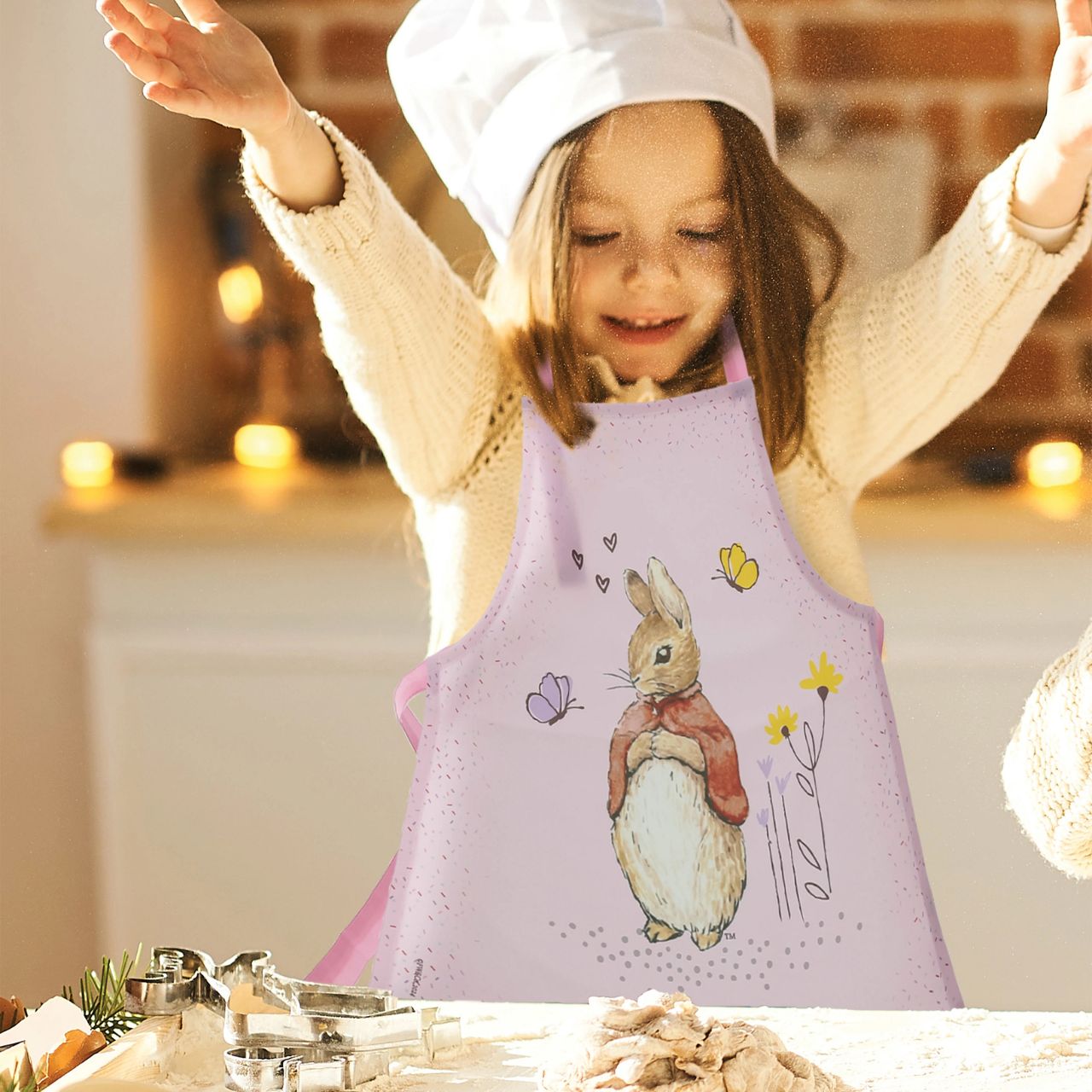 Introducing the delightful Flopsy Bunny apron, designed to make every cooking or crafting adventure a memorable one. Crafted with a super soft, wipeable fabric, it ensures easy clean-up, while the hook & loop tape fastening on the neck tie offers extra safety and comfort for your little one.