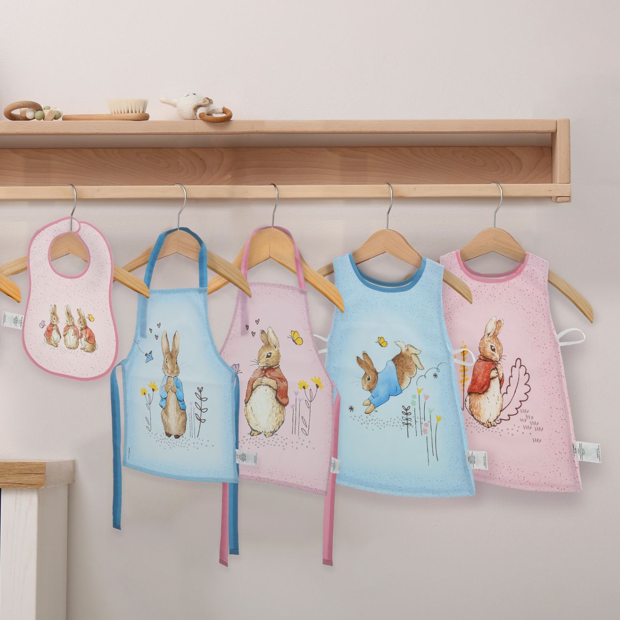 Introducing the delightful Flopsy Bunny apron, designed to make every cooking or crafting adventure a memorable one. Crafted with a super soft, wipeable fabric, it ensures easy clean-up, while the hook & loop tape fastening on the neck tie offers extra safety and comfort for your little one.