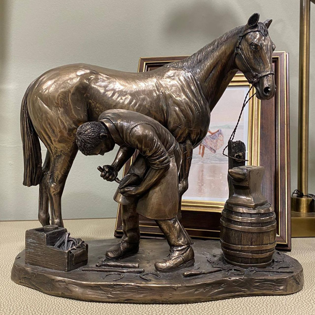 This is a beautiful cold cast bronze blacksmith figurine. A stunning sculpture of a horse and blacksmith, ideal for the equestrian fanatic in your life.
