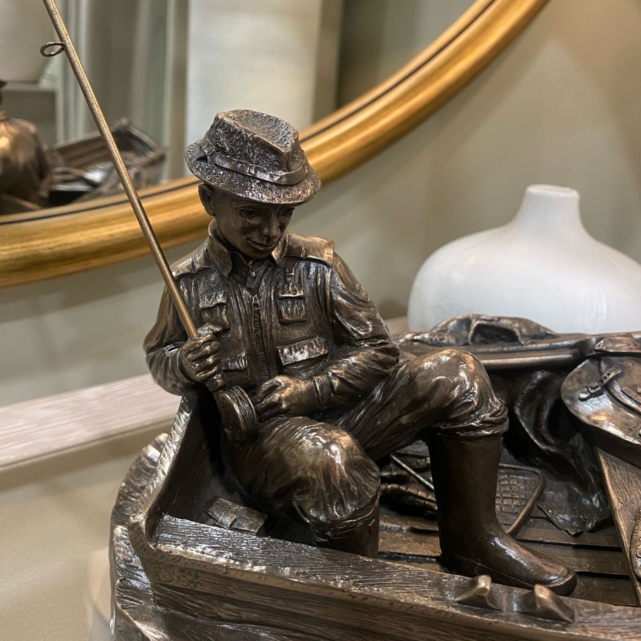 This stunning piece of a man fishing from a boat made by Genesis could be a great gift for a fishing enthusiast or as a presentation piece.