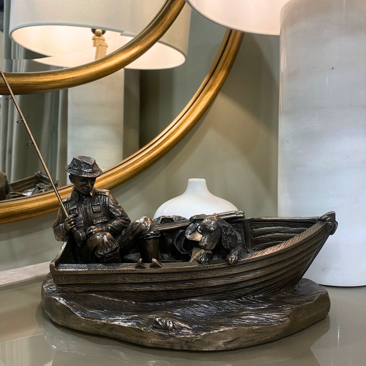 This stunning piece of a man fishing from a boat made by Genesis could be a great gift for a fishing enthusiast or as a presentation piece.