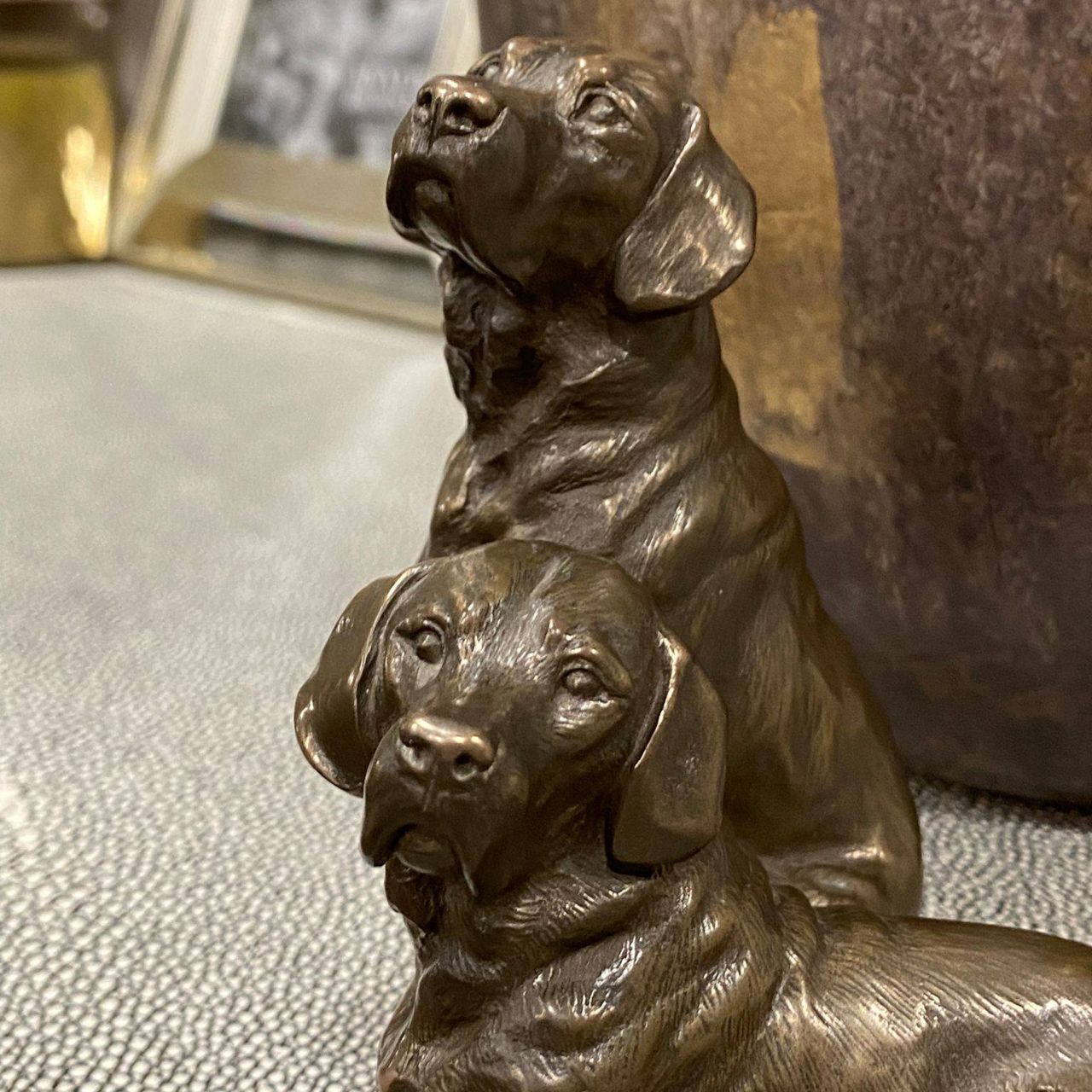Pair of Labradors sculpture by Genesis Ireland. Bronze coloured and beautifully crafted. this is the perfect gift for the dog lover in your life.
