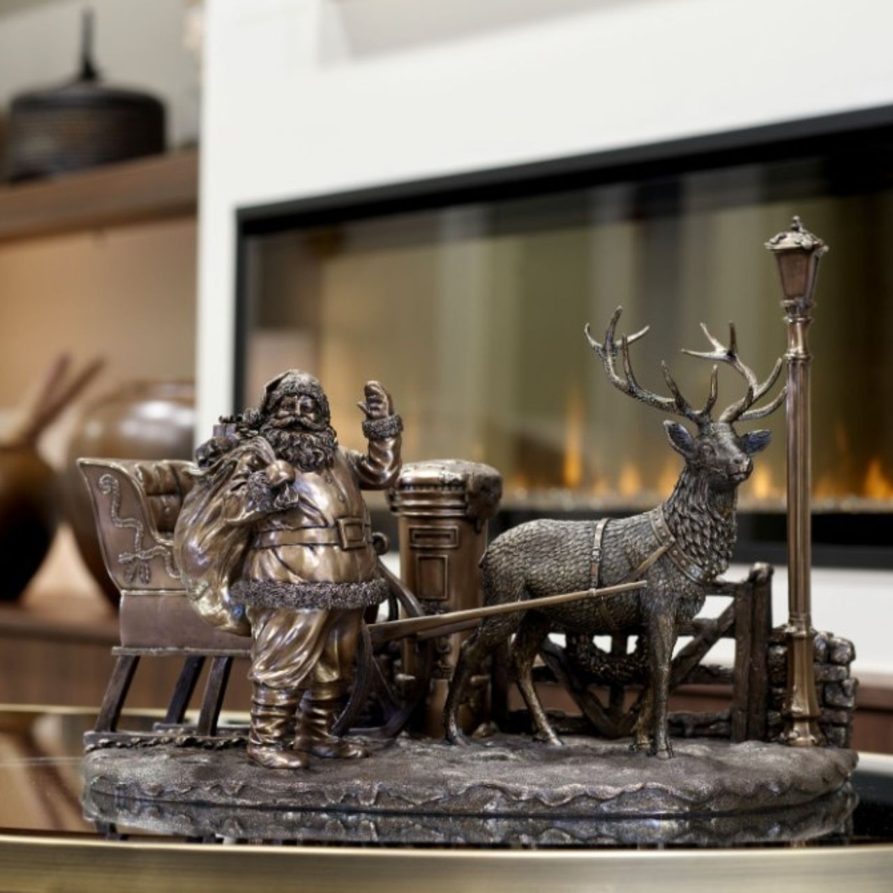 Santa in the Countryside by Genesis A beautiful bronze coloured Christmas decoration, by Genesis Ireland. Depicting Santa and his sleigh, ready to deliver Christmas cheer to the local village.