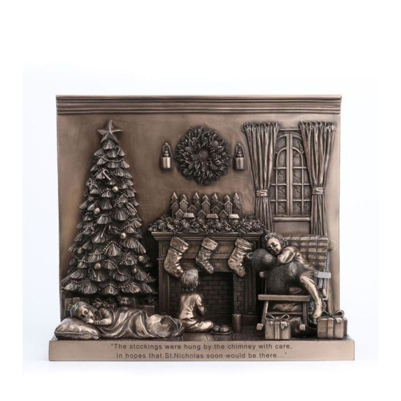 Waiting for Santa by Genesis A gorgeous bronze coloured Christmas decoration by Genesis Ireland. Beautifully crafted, this Christmas scene incorporates three children trying to stay awake to see Santa! Showcasing the classic Christmas scene of sitting around the Christmas tree and stockings over the fireplace, this ornament is finished off with the inscription "The stockings were hung by the chimney with care in hope that St. Nicholas soon would be there..."