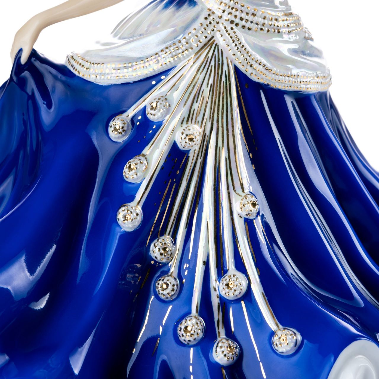 English Ladies Going to the Ball Midnight  Going to the Ball midnight is a beautifully hand-made figurine decorated in a deep royal blue colourway. This sophisticated piece is detailed with mother-of-pearl lustre and real 24-carat gold highlights that glisten when hit by the light.