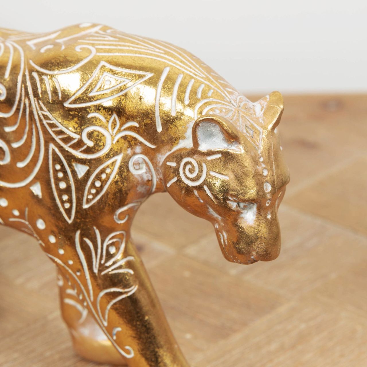 A beautiful gilt carved wood effect big cat ornament with intricate patterns. From the Global Artisan collection