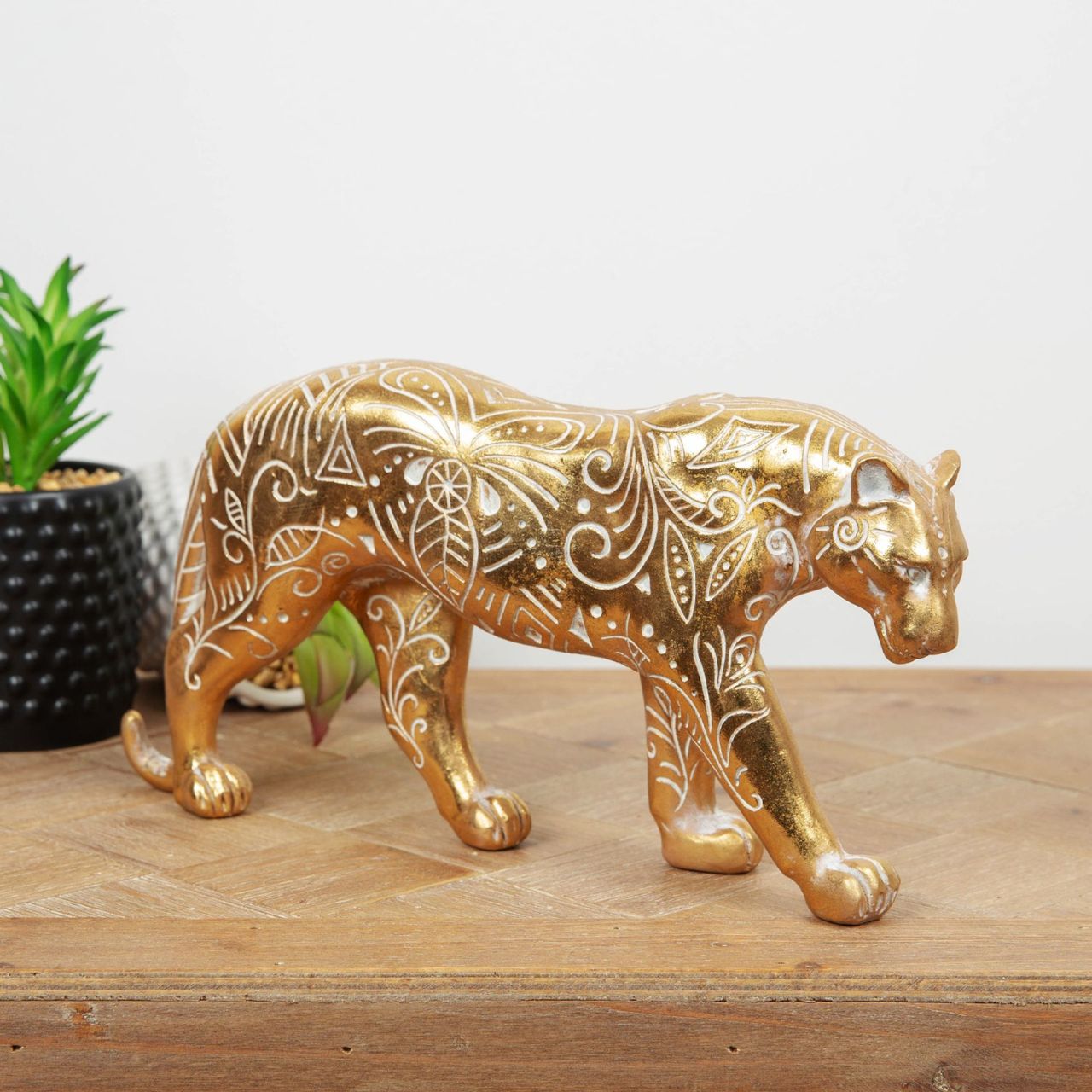 A beautiful gilt carved wood effect big cat ornament with intricate patterns. From the Global Artisan collection