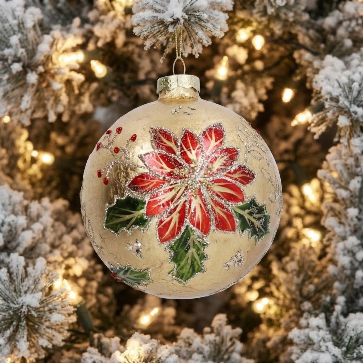 Bring timeless elegance to your Christmas tree with this stunning Gisela Graham Gold Foil Poinsettia Glass Bauble. Hand-decorated with luxurious gold foil detailing, the iconic poinsettia design captures festive beauty in a classic spherical shape.