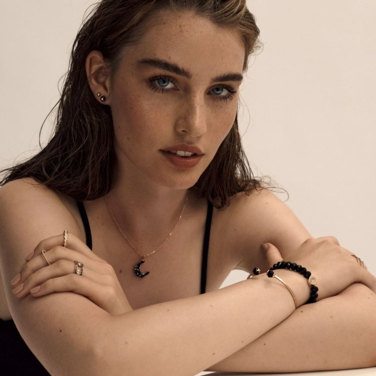 Half Moon Pendant Sapphire - Rose Gold by Tipperary Inspired by the hypnotic energy of the glowing moon, this collection is contemporary and minimalist yet luxuriously adorned with the clearest sparkling stones.