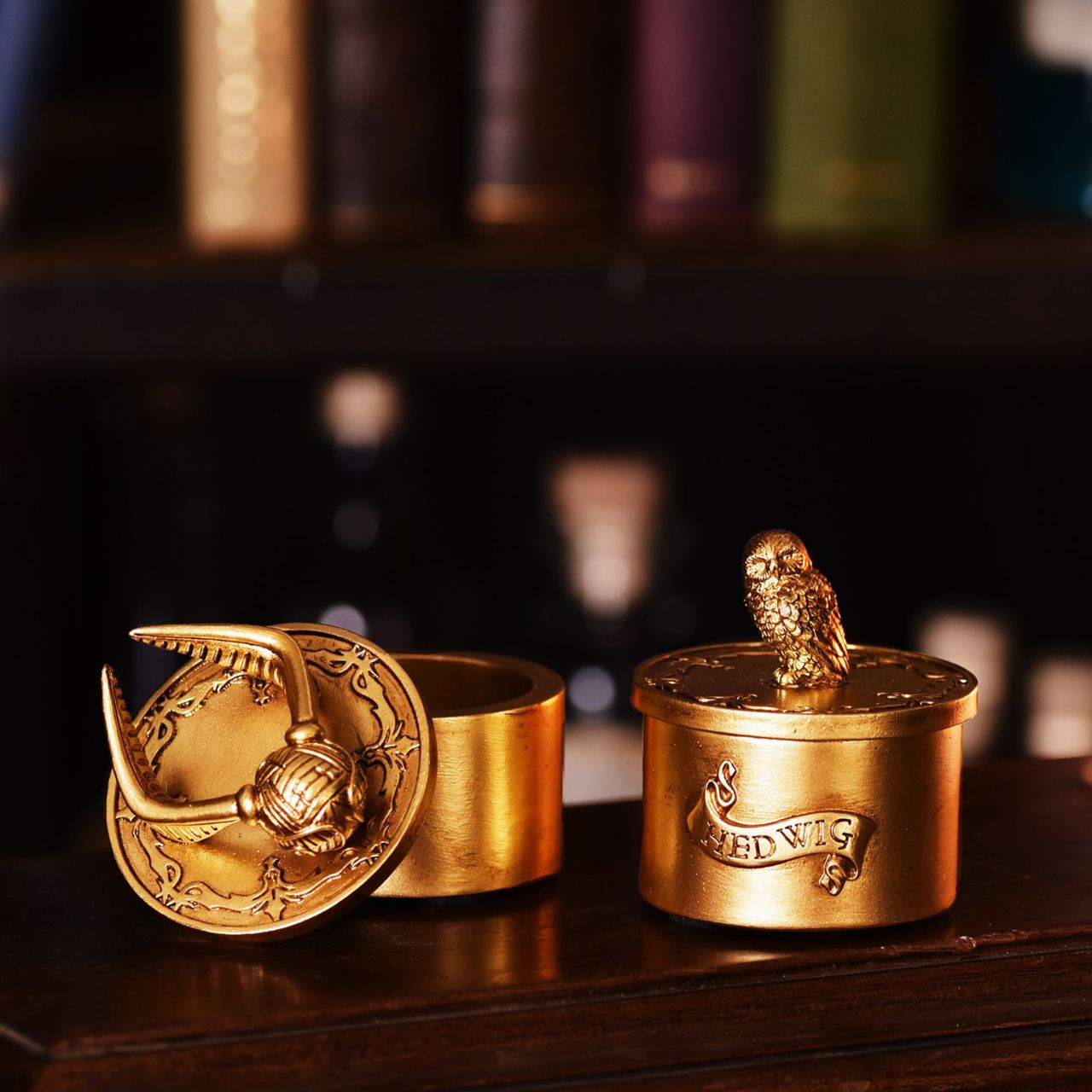Warner Bros Harry Potter Alumni Trinket Box Snitch A Snitch trinket box by HARRY POTTER®. This spellbinding trinket box is adorned a Golden Snitch and filled with Hogwarts magic.