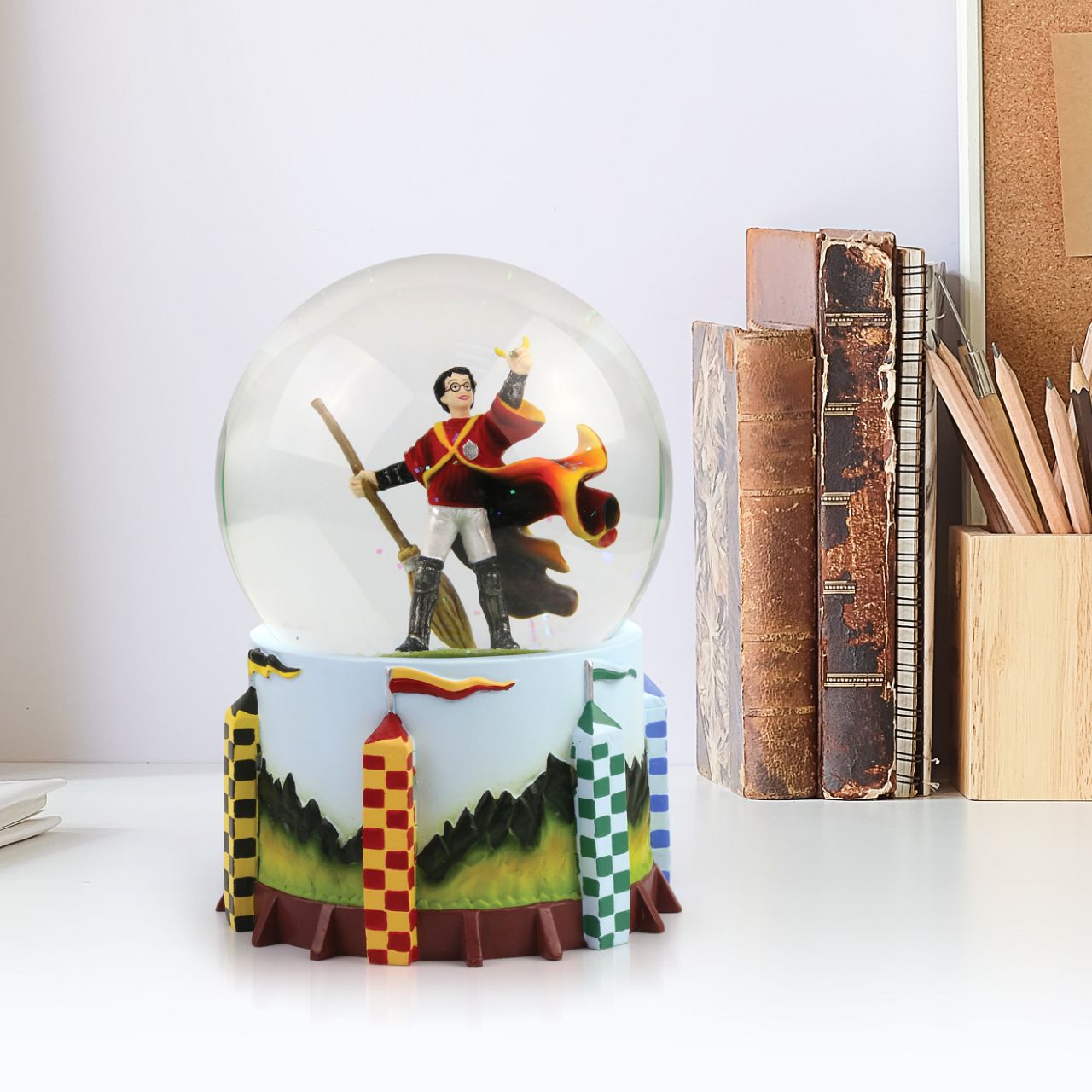 Harry Potter Quidditch Waterball Celebrate Gryffindor's triumphant win with this Harry Potter Waterball. This is taken from the iconic scene where Harry Potter wins the Quidditch game in Harry Potter and the Philosopher's stone, by nearly swallowing the Golden Snitch and then holding it joyfully above his head.