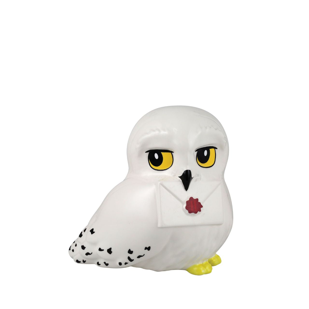 Sculpted Hedwig Money Bank This sculpted Hedwig money bank holds a Hogwarts letter in her beak. This cute Owl is based on Harry Potter's own pet that we see throughout the film franchise. With a coin slot hidden on the back of her head, this is the perfect gift for any fan, young or old.