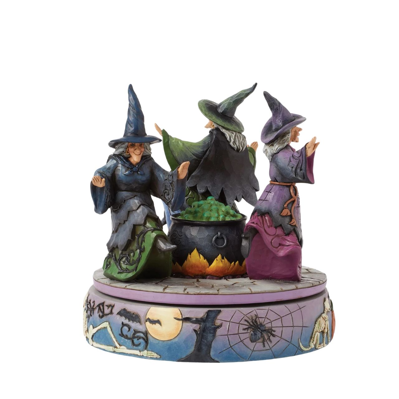 Enter the world of Halloween with this hand-touch rotation Jim Shore movement figurine featuring two witches dancing around a bubbling cauldron. Adorned with jack-o-lanterns, skeletons, tombstones, spiders, snakes, black cats, and bats, it's a bewitching scene.