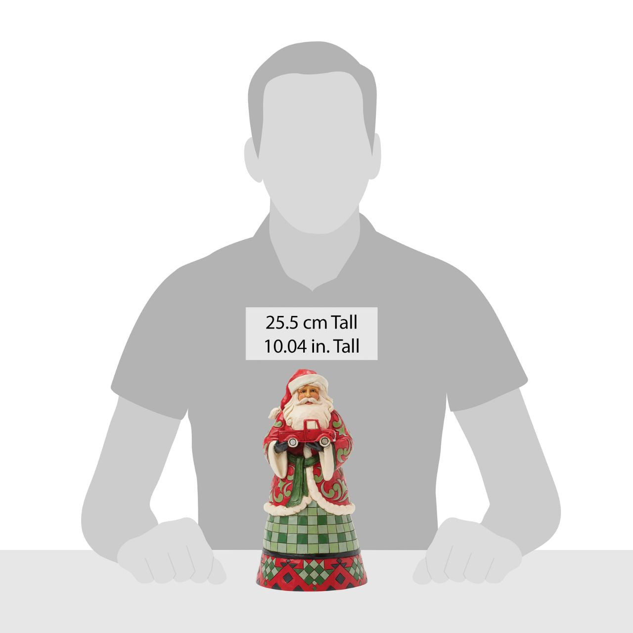 This charming Jim Shore design features Santa holding a Red Truck, dressed in a cosy buffalo plaid cloak that embodies holiday warmth. He captures the spirit of the season.