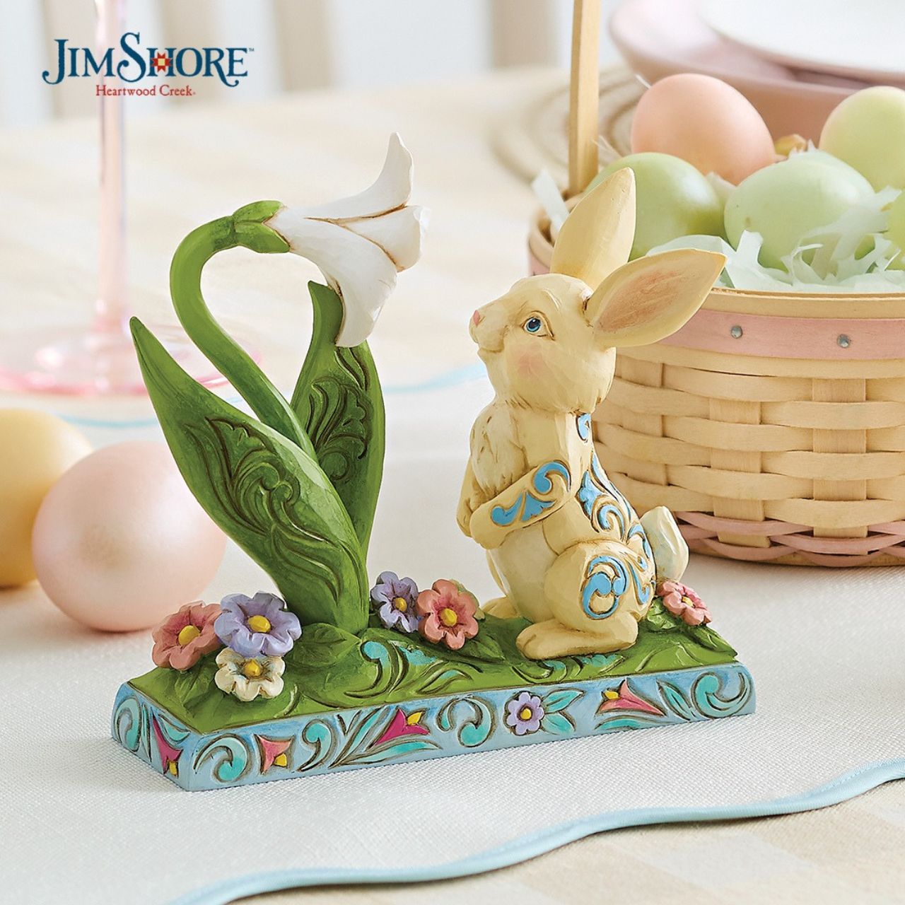 Celebrate Spring breaking through and the joy of Easter with this sweet figurine of a bunny sniffing the first Lilly of the season. Hand carved and painted.