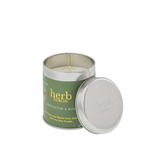 Experience the warmth of the holidays with our Christmas Mistletoe & Wine Tin Candle. This delightful blend of festive scents will fill your home with comfort and joy.