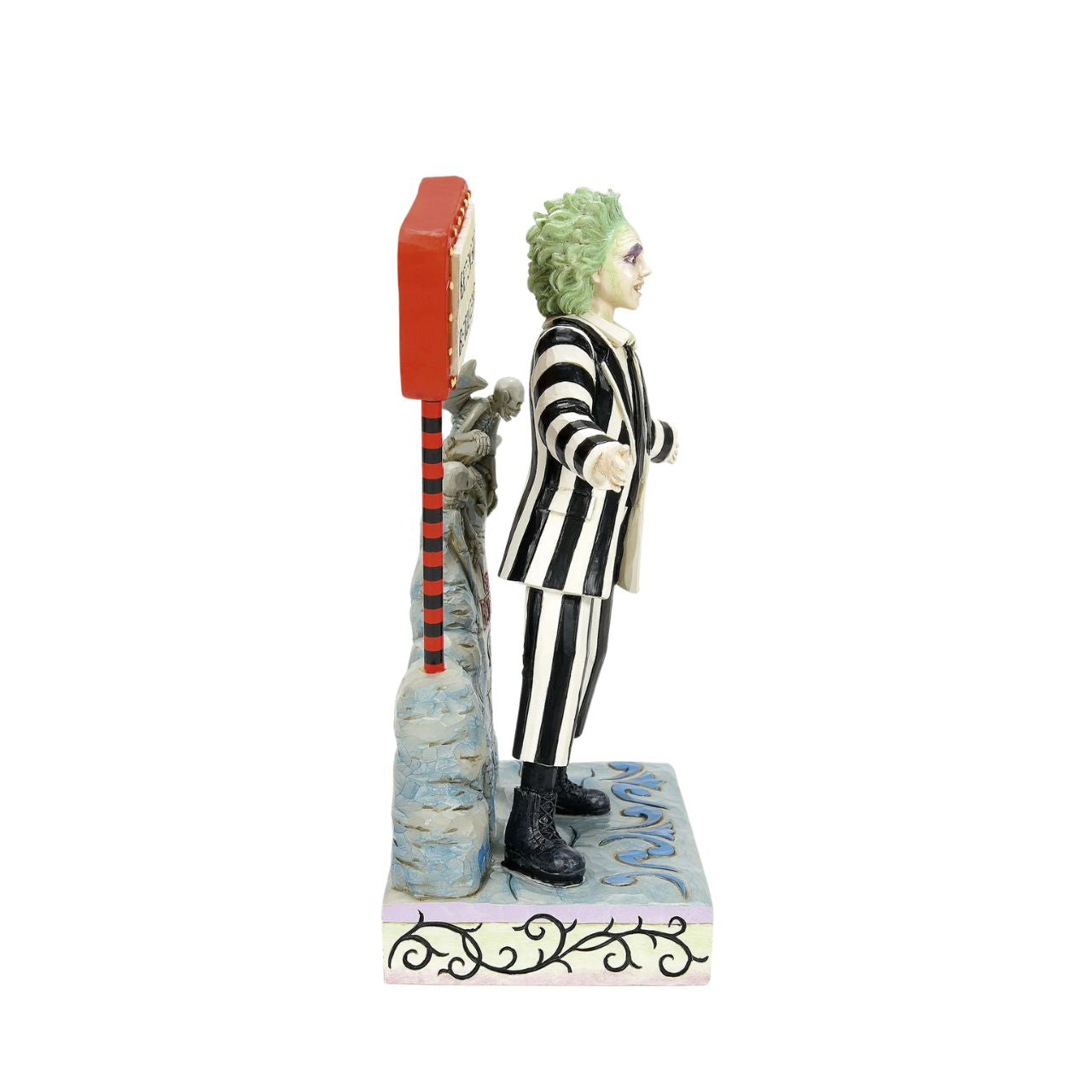 Beetlejuice, Beetlejuice, Beetlejuice... He's here. The iconic bio-exorcist from the 1988 Tim Burton film has arrived and this time, he has a Jim Shore twist. Crafted from high quality cast stone and hand-painted, this light up figurine features the main (dead) man himself, atop his grave with an illuminated "Vegas" style LED sign letting all know who he is.