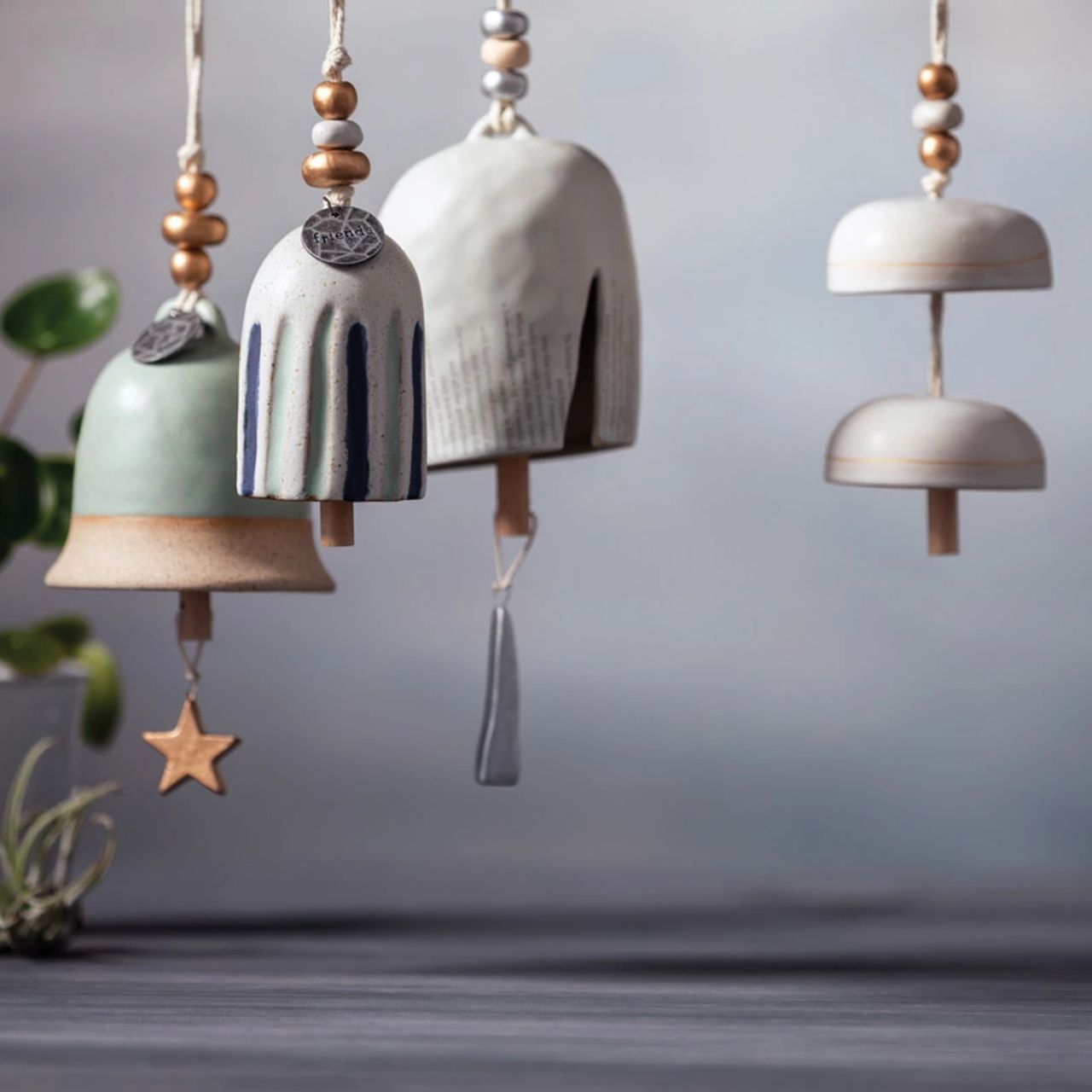 Give beauty and relaxation with our Inspired Bells collection, a selection of artisan bells in soft, serene colours with soothing, gentle rings bearing sentiments of faith and love. Our Inspired Bell - Friends is a ceramic indoor/outdoor bell in white with blue and green stripes. The sentiment on the bell reads, "Friends." You can give this calming memory bell as a birthday, Christmas anytime, rough times, self-care, or hospital gift.