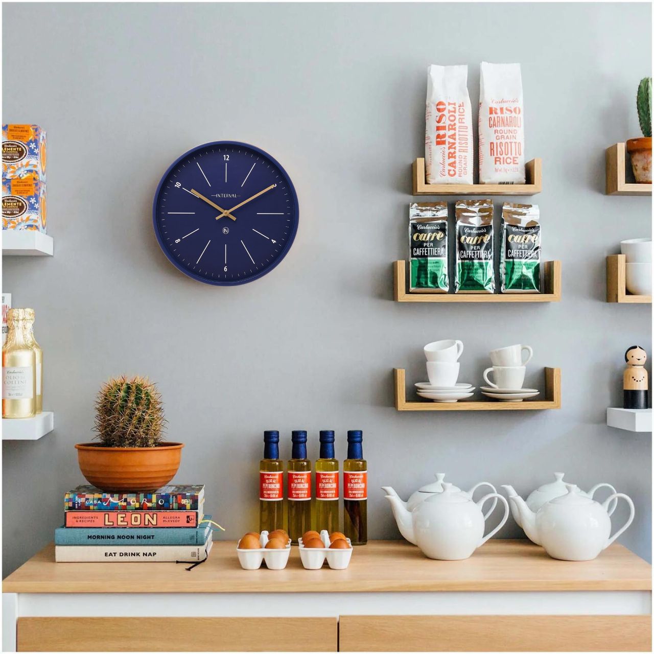 Introducing the Interval Metal Wall Clock in Navy, a sleek and contemporary timepiece that combines functionality with modern design.