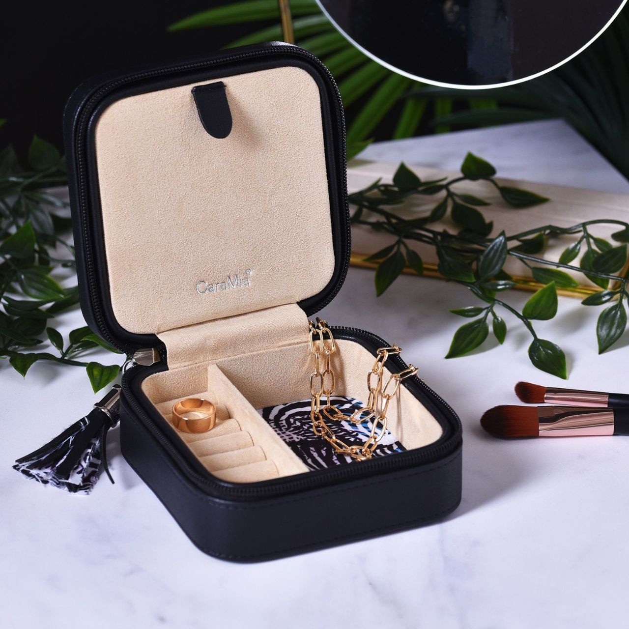This striking jewellery case features a soft velvet interior with statement 'Zebracrossing' print and matt black, faux leather exterior.