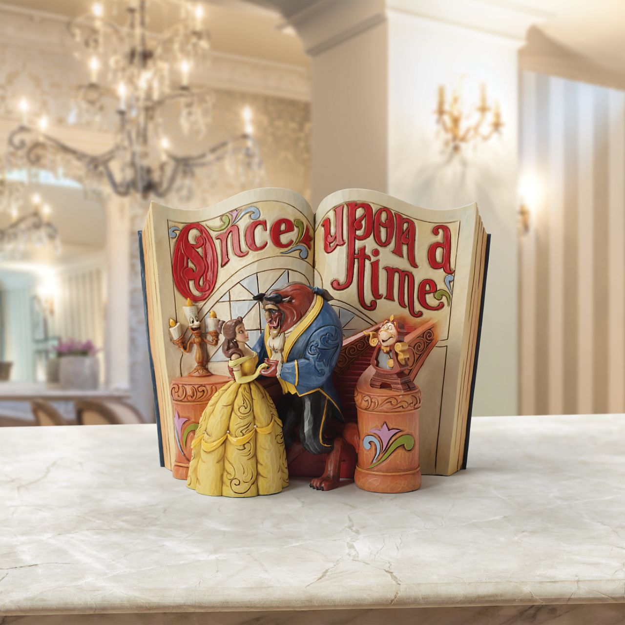 A tale as old as time and a song as old as rhyme... this beauty and her beast takes storybooks into a whole new dimension. Designed by award winning artist and sculptor, Jim Shore for the Disney Traditions brand. Book title written in gold paint on the back of the book.