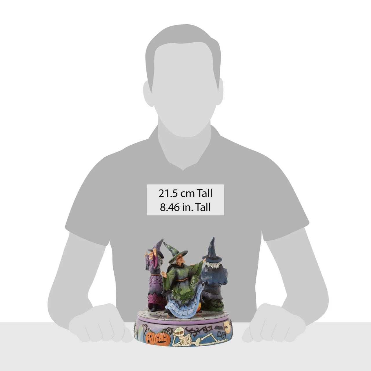 Enter the world of Halloween with this hand-touch rotation Jim Shore movement figurine featuring two witches dancing around a bubbling cauldron. Adorned with jack-o-lanterns, skeletons, tombstones, spiders, snakes, black cats, and bats, it's a bewitching scene.