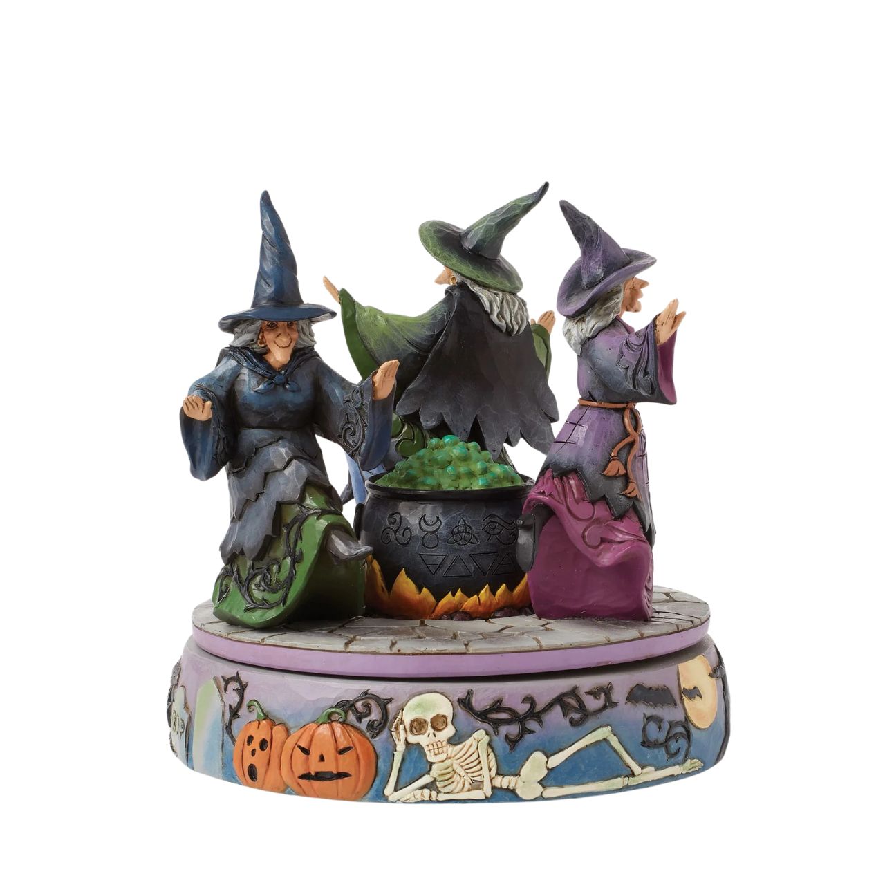 Enter the world of Halloween with this hand-touch rotation Jim Shore movement figurine featuring two witches dancing around a bubbling cauldron. Adorned with jack-o-lanterns, skeletons, tombstones, spiders, snakes, black cats, and bats, it's a bewitching scene.