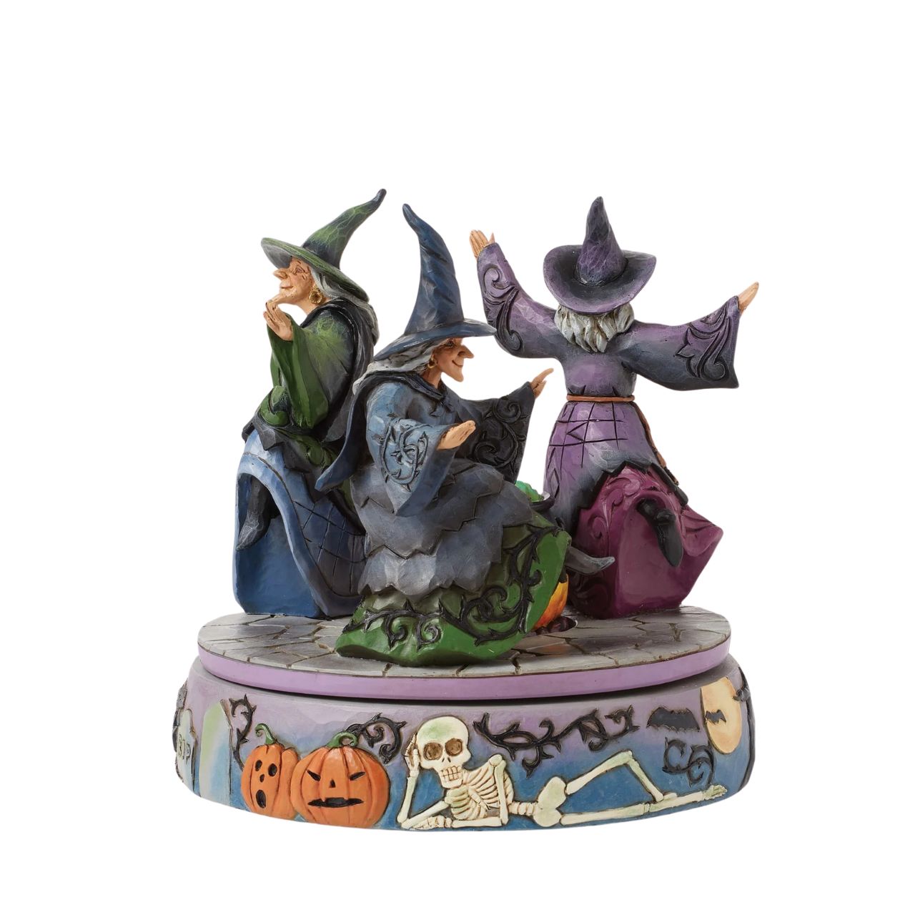 Enter the world of Halloween with this hand-touch rotation Jim Shore movement figurine featuring two witches dancing around a bubbling cauldron. Adorned with jack-o-lanterns, skeletons, tombstones, spiders, snakes, black cats, and bats, it's a bewitching scene.