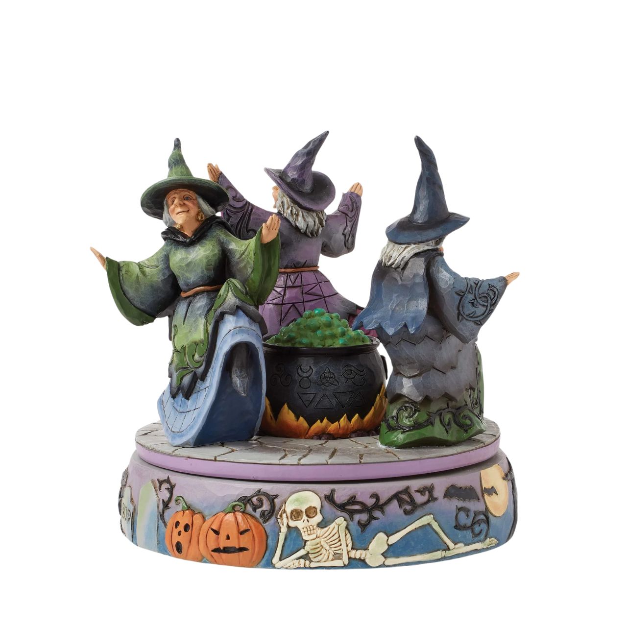 Enter the world of Halloween with this hand-touch rotation Jim Shore movement figurine featuring two witches dancing around a bubbling cauldron. Adorned with jack-o-lanterns, skeletons, tombstones, spiders, snakes, black cats, and bats, it's a bewitching scene.