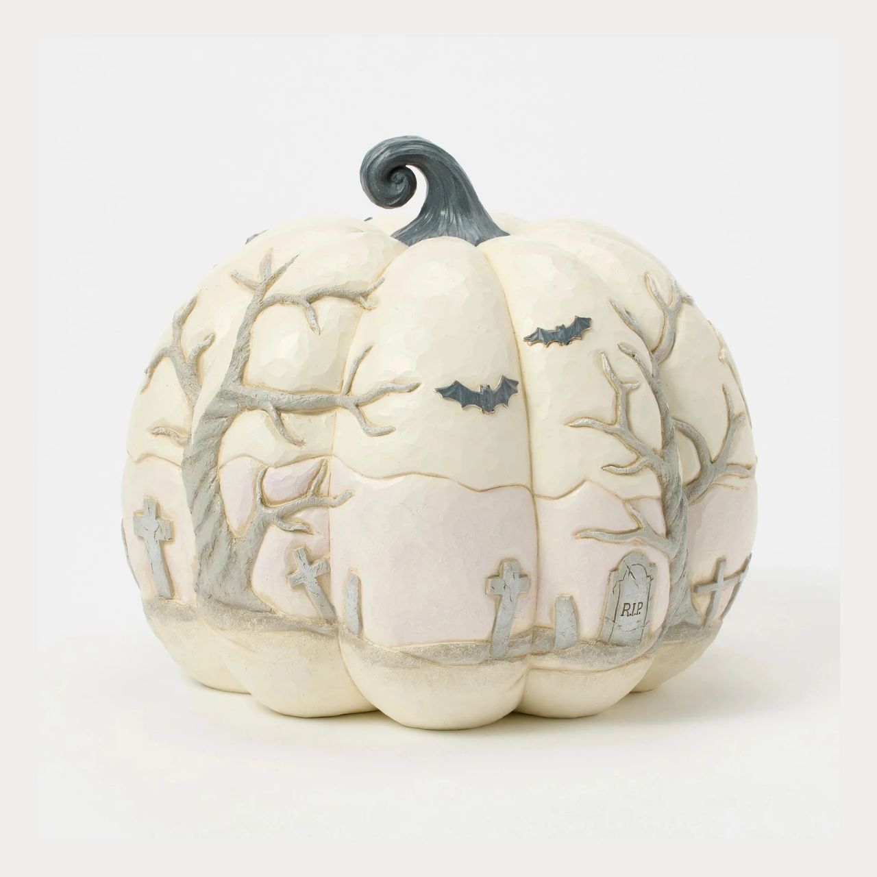Capture the spirit of Halloween with this eerie Jim Shore pumpkin figurine, showcasing a haunted graveyard scene complete with a spooky haunted house, flying bats, and a full moon. With intricate details and haunting ambiance, prepare to scare.