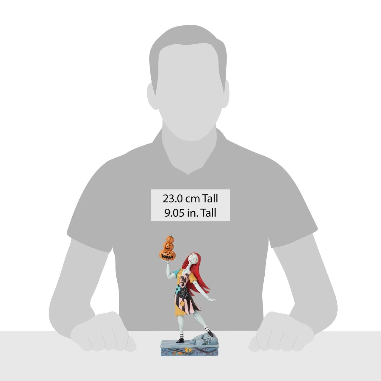 In this enchanting Jim Shore piece, Sally from The Nightmare Before Christmas raises a stack of intricately carved pumpkins into the night air. Her dress, fashioned with the artist's iconic patchwork and rosemaling designs, adds whimsical allure.