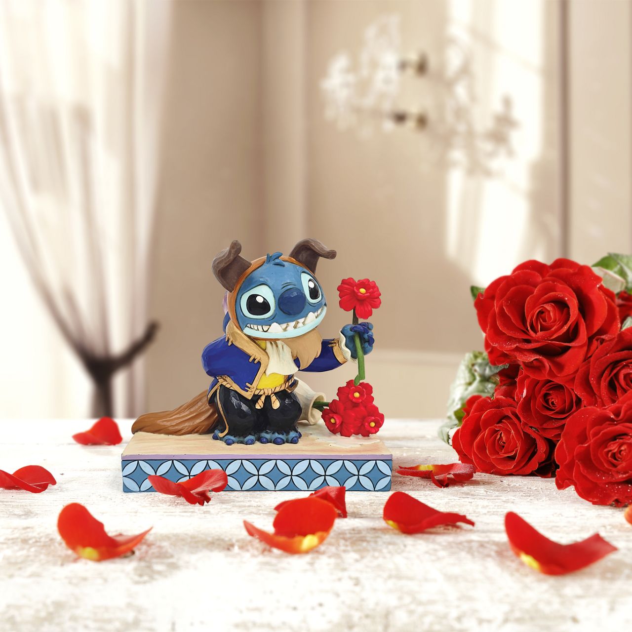In this charming Jim Shore design, Stitch takes on the role of the Beast from Disney's beloved tale, dressed in the iconic blue suit. With an adorable smile, Stitch presents a flower, to you the collector.