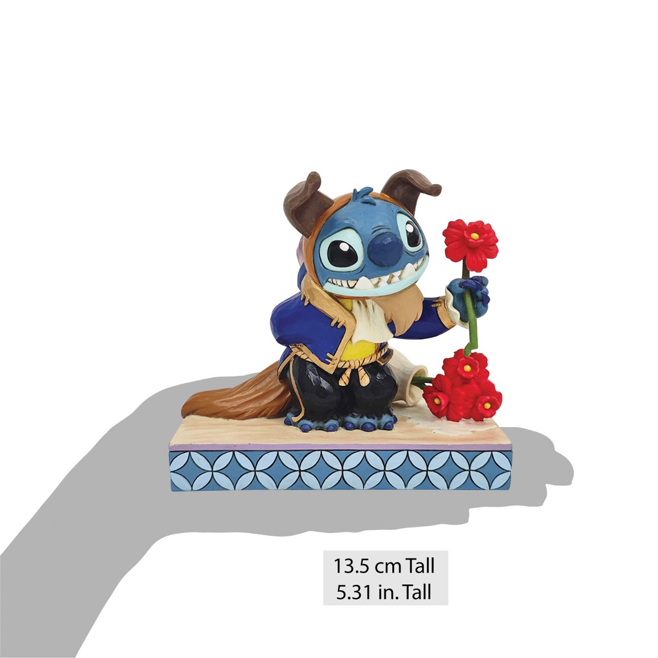 In this charming Jim Shore design, Stitch takes on the role of the Beast from Disney's beloved tale, dressed in the iconic blue suit. With an adorable smile, Stitch presents a flower, to you the collector.