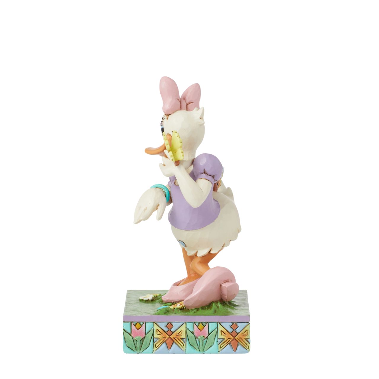 Donald Ducks super cute girlfriend Daisy Duck is here to celebrate the joy of Spring. Hand crafted and painted, she is part of the Disney Traditions collection by Jim Shore. Comes in a fully branded gift box.