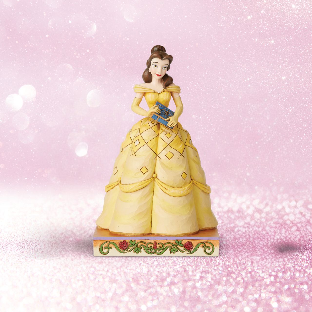 Disney Traditions Book-Smart Beauty Belle Princess Passion Belle always has her nose in a book, filling her imagination with adventure. The book-smart beauty begins her own timeless tale when she meets the Beast. In this lovely Jim Shore design, Belle wears her classic yellow gown and holds a book in her hands.