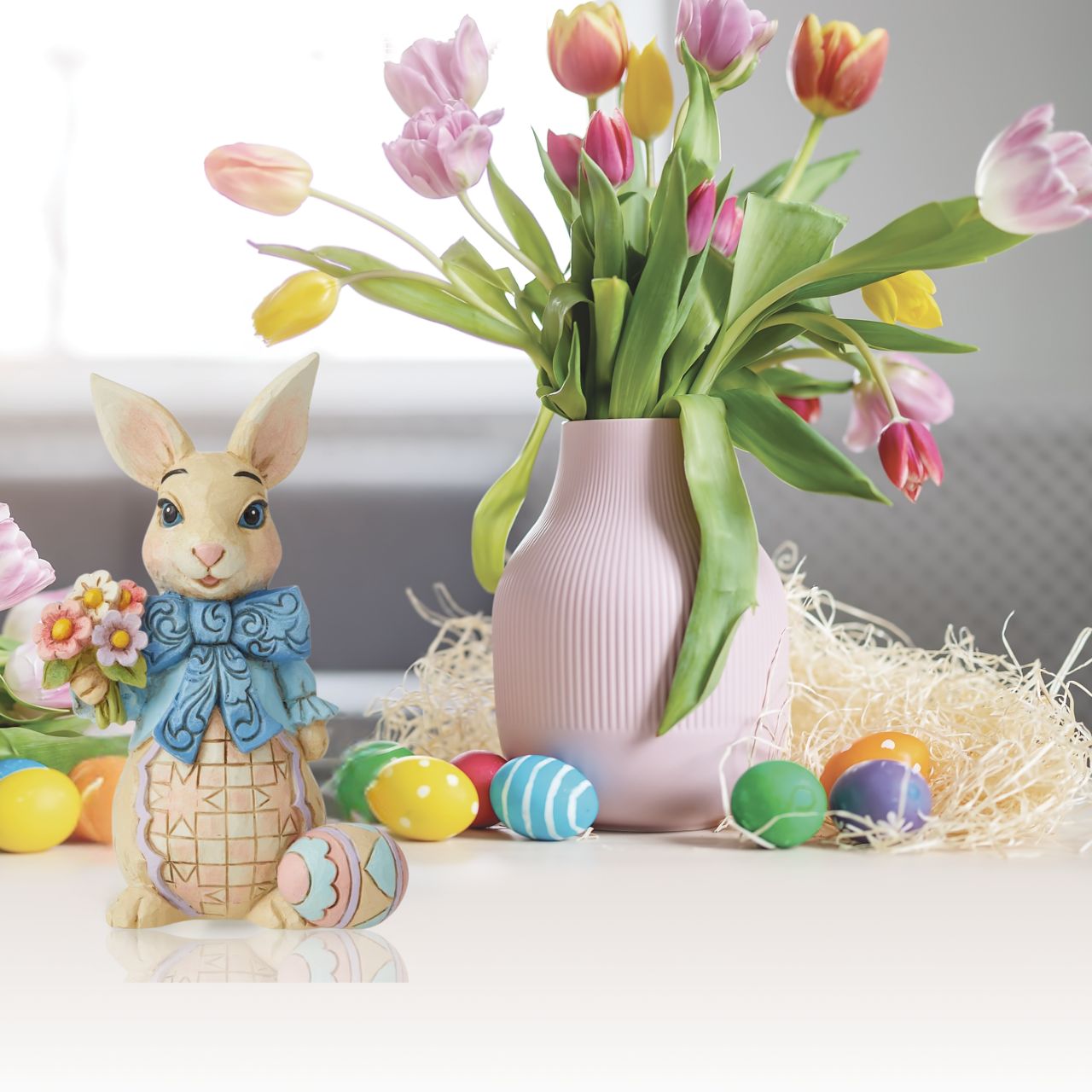Spring brings new beginnings and the blossoming of new life, flowers, and growth. Celebrate the season with Jim Shore's Heartwood Creek collection. This bunny wears a bow while boasting a bouquet of fresh flowers for your family this Easter.