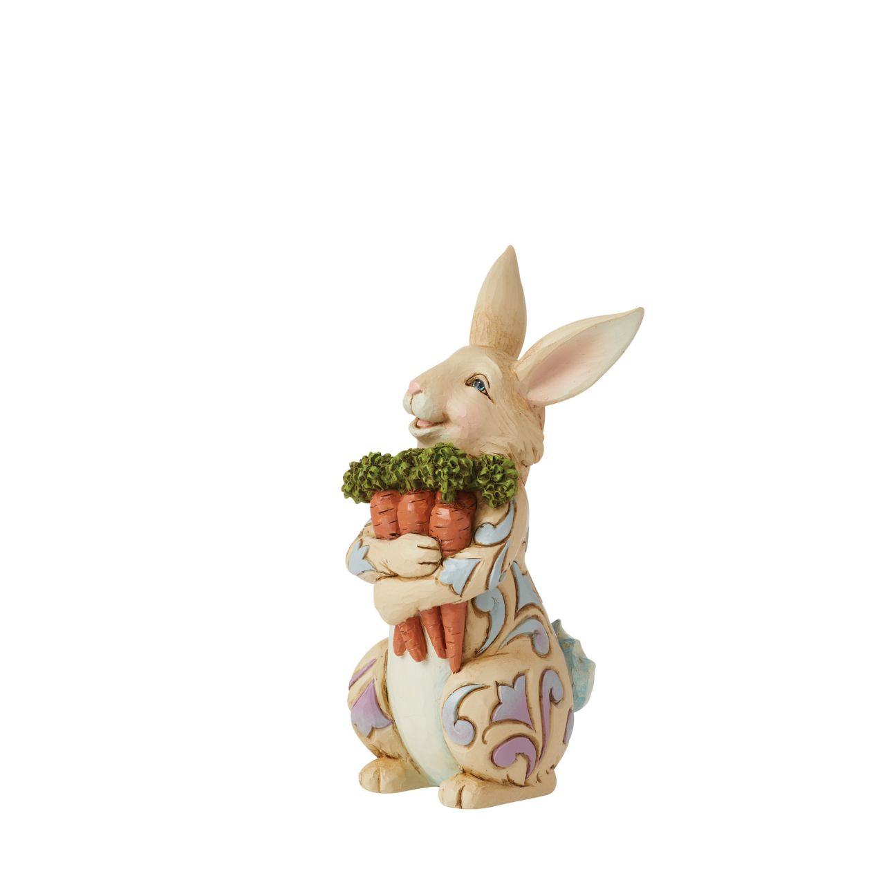 With an arm full of carrots, this cheerful Pint bunny is ready for Easter| Colourful blue and purple rosemaling on his fur, this fluffy Jim Shore rabbit figurine is a delightful edition to your Springtime home décor.